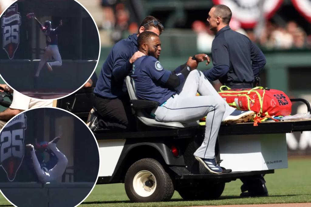 Victor Robles carted off field after making insane diving catch for Mariners