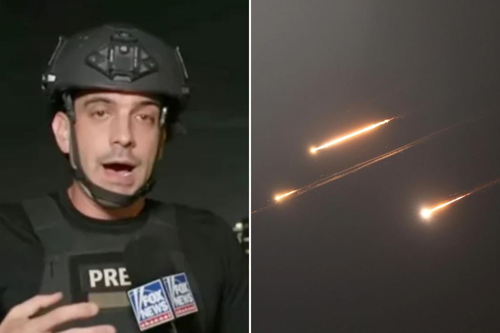 Fox News reporter Trey Yingst runs for cover as missiles rain down during live broadcast from Tel Aviv